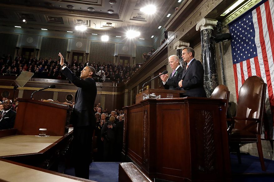 President Barack Obama waves before giving his State of the Union address during a joint session of Congress on Capitol Hill in Washington, Tuesday Feb. 12, 2013. Vice President Joe Biden and House Speaker John Boehner of Ohio stand behind the president. (AP Photo/Charles Dharapak, Pool)