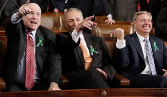 From left, Sen. John McCain, R-Ariz., Sen. Charles Schumer, D-N.Y. and Sen. Lindsey Graham, R-S.C. sit on Capitol Hill in Washington, Tuesday, Feb. 12, 2013, before President Barack Obama&#39;s State of the Union address during a joint session of Congress . (AP Photo/Charles Dharapak, Pool)