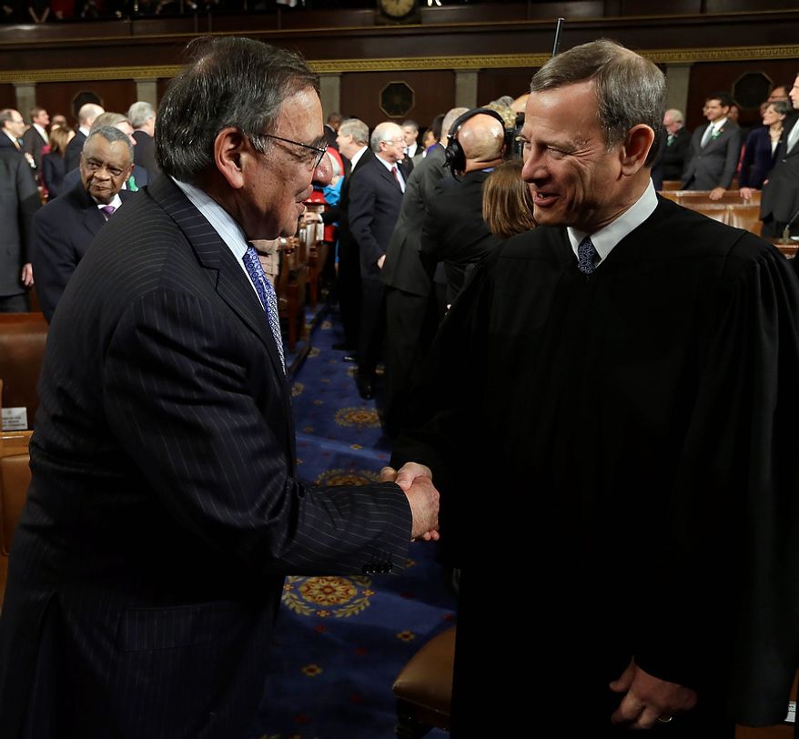 Outgoing Defense Secretary Leon Panetta, left, shakes hands with Chief Justice John Roberts before President Barack Obama&#x27;s State of the Union address during a joint session of Congress on Capitol Hill in Washington, Tuesday Feb. 12, 2013. (AP Photo/Charles Dharapak Pool)