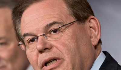 Sen. Robert Menendez, New Jersey Democrat, said he traveled on a plane owned by Dr. Melgen but denied that he engaged with prostitutes. (Associated Press)