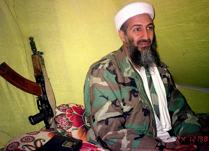 ** FILE ** In this Dec. 24, 1998, photo, Muslim militant and al Qaeda leader Osama Bin Laden speaks to a selected group of reporters in mountains of Helmand province in southern Afghanistan. (AP Photo/Rahimullah Yousafzai)