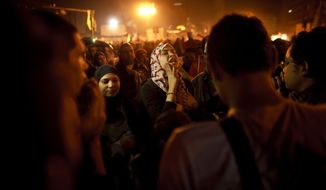An Egyptian woman chants slogans in Tahrir Square in Cairo on Friday, Jan. 25, 2013, two years after the uprising that ousted President Hosni Mubarak. (AP Photo/Maya Alleruzzo)