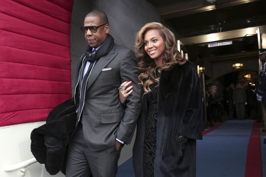 Recording artists Jay-Z and Beyonce arrive at the U.S. Capitol in Washington for President Obama&#x27;s ceremonial swearing-in ceremony on Monday, Jan. 21, 2013, during the 57th Presidential Inauguration. (AP Photo/Win McNamee, Pool)