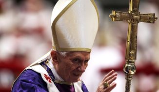 Pope Benedict XVI greets the faithful at the end of the Ash Wednesday Mass in St. Peter&#39;s Basilica at the Vatican on Wednesday, Feb. 13, 2013. (AP Photo/Gregorio Borgia)

