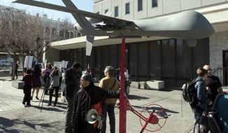 A model of a military-style drone stands outside the Alameda County Administration Building in Oakland, Calif., on Thursday, Feb. 14, 2013, before the start of a hearing on the Alameda County sheriff&#39;s plan to acquire a drone for aerial enforcement. (AP Photo/The Contra Costa Times, D. Ross Cameron)