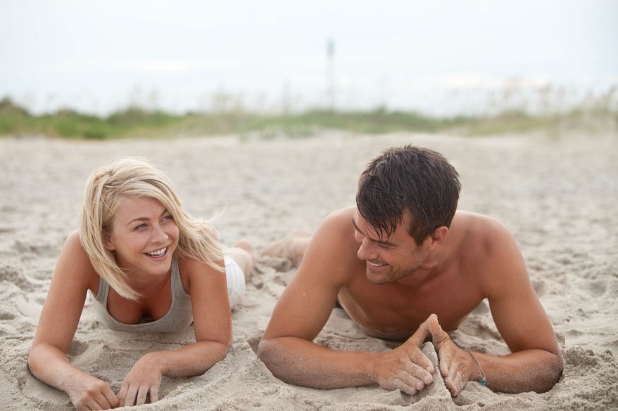 Julianne Hough's character leaves Boston with police in pursuit and ends up in a South Carolina beach town where she bonds with Josh Duhamel's character in "Safe Haven." (Relativity Media via Associated Press)