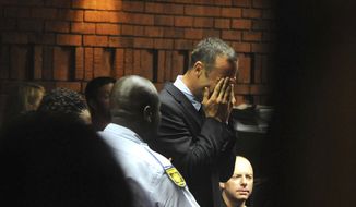 ** FILE ** Athlete Oscar Pistorius weeps in court in Pretoria, South Africa, on Friday, Feb. 15, 2013, at his bail hearing in the death of his girlfriend, Reeva Steenkamp. (AP Photo/Antione de Ras, Independent Newspapers Ltd. South Africa)