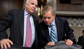 Sens. John McCain (left) and Lindsey Graham on Sunday indicated Chuck Hagel’s nomination as defense secretary likely will be confirmed when the Senate reconvenes. “I don’t believe he’s qualified, but I don’t believe we should hold up his confirmation any further,” Mr. McCain said. (Associated Press)