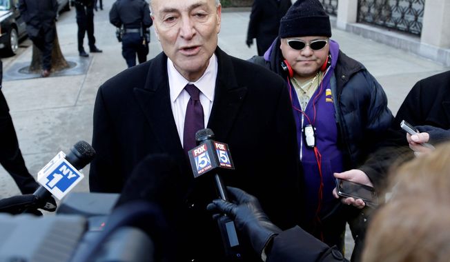 “I am not going to get into the details of our negotiating, publicly, but I can tell you we’ve both made progress and have a ways to go” before an agreement on background checks, Sen. Charles E. Schumer, New York Democrat, says. (Associated Press)