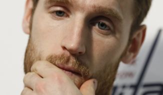 **FILE** Washington Capitals&#39; Brooks Laich rubs his face during a news conference at the Kettler Capitals Iceplex in Arlington, Va., Thursday, May 5, 2011. The Capitals were swept out of the playoffs by the Tampa Bay Lightning, losing Game 4 at Tampa on Wednesday night.(AP Photo/Luis M. Alvarez)