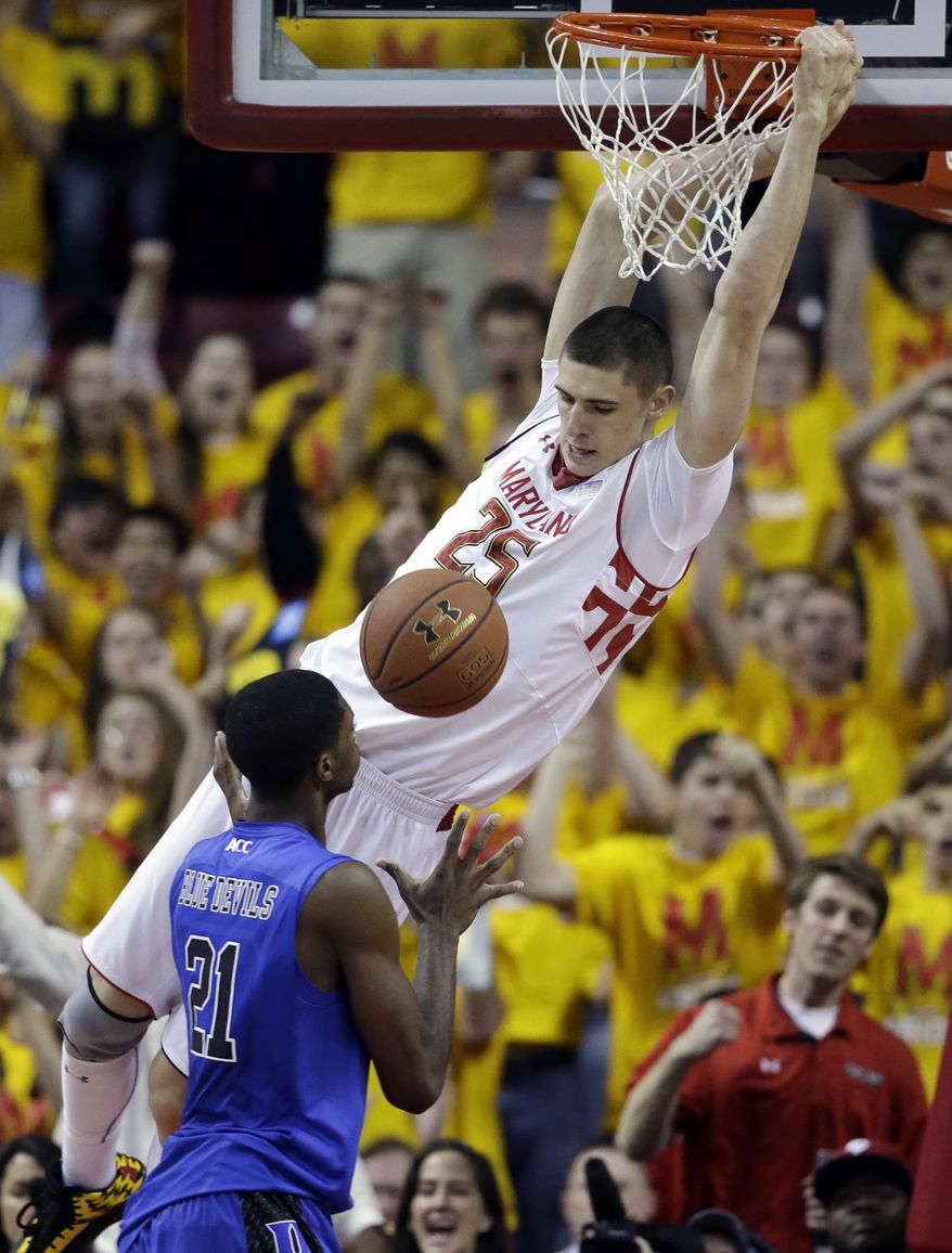 Maryland center Alex Len, top, of Ukraine, dunks on Duke forward Amile Jefferson in the first half of an NCAA college basketball game in College Park, Md., Saturday, Feb. 16, 2013. Maryland won 83-81. (AP Photo/Patrick Semansky)