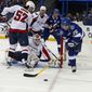 Tampa Bay Lightning&#39;s Martin St. Louis (26) tries to put back a rebound past Washington Capitals&#39; Mike Green (52) and goalie Braden Holtby during the second period of an NHL hockey game on Thursday, Feb. 14, 2013, in Tampa, Fla. (AP Photo/Mike Carlson)