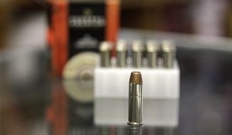 **FILE** A box of ammunition is seen on Oct. 17, 2012, on the counter of a gun shop in Tinley Park, Ill. (Associated Press)
