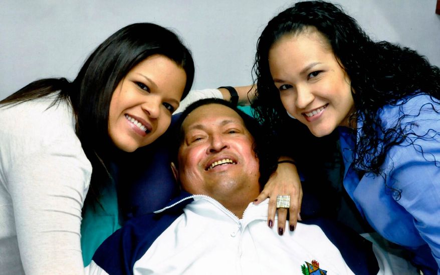 ** FILE ** In this photo released Friday, Feb. 15, 2013, by Miraflores Presidential Press Office, Venezuela's President Hugo Chavez, center, poses for a photo with his daughters, Maria Gabriela, left, and Rosa Virginia at an unknown location in Havana, Cuba, Thursday, Feb. 14, 2013. (AP Photo/Miraflores Presidential Press Office)
