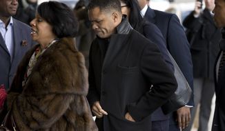 ** FILE ** Former Illinois Rep. Jesse Jackson Jr. and his legal team arrives at the E. Barrett Prettyman Federal Courthouse in Washington on Feb. 20, 2013. (Associated Press)