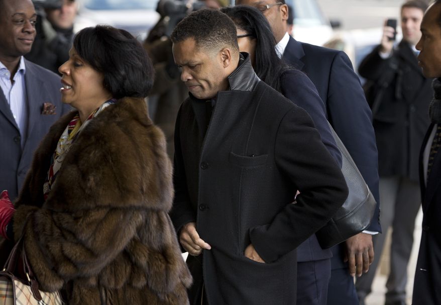 ** FILE ** Former Illinois Rep. Jesse Jackson Jr. and his legal team arrives at the E. Barrett Prettyman Federal Courthouse in Washington on Feb. 20, 2013. (Associated Press)