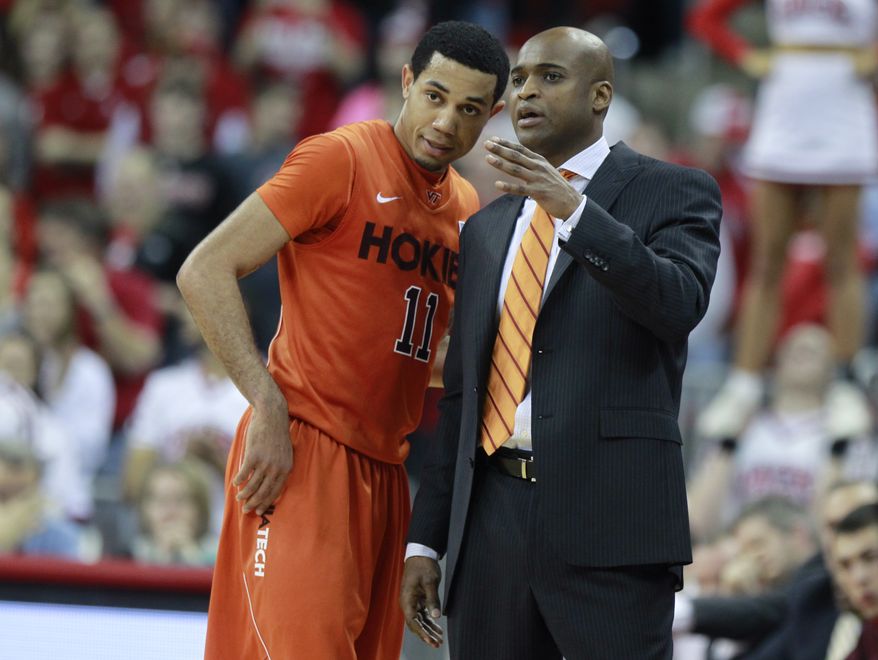 Virginia Tech&#x27;s Erick Green (11) talks with coach James Johnson in the second half of an NCAA college basketball game against North Carolina State, Saturday, Feb. 16, 2013, in Raleigh, N.C. (AP Photo/The News &amp; Observer, Ethan Hyman) 