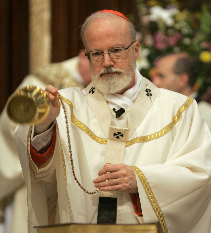 **FILE** Cardinal Sean O'Malley, archbishop of the Roman Catholic Archdiocese of Boston, sprinkles incense around the altar at Cathedral of St. Mary of the Assumption in Fall River, Mass., on April 18, 2006, as he begins to celebrate Mass. (Associated Press)