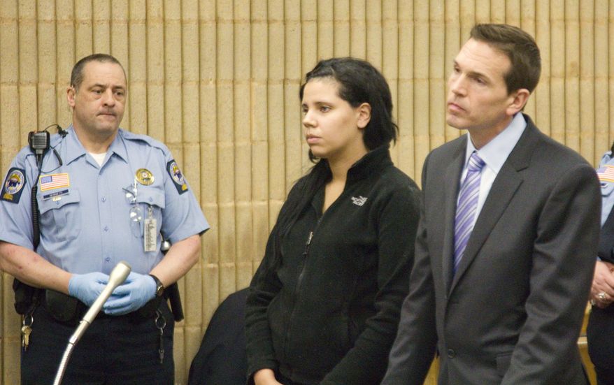 Amanda Bowden stands with her public defender as she is arraigned at Superior Court in Milford, Conn., Wednesday, Feb. 20, 2013. She is accused of threatening to commit a suicide bombing and mass shooting at Gateway Community College in New Haven. (AP Photo/New Haven Register, Rich Scinto)