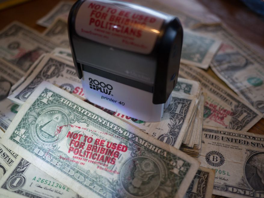 Ben & Jerry's wants customers to eat their ice cream, and stamp campaign finance reform slogans on money. (Ben & Jerry's)