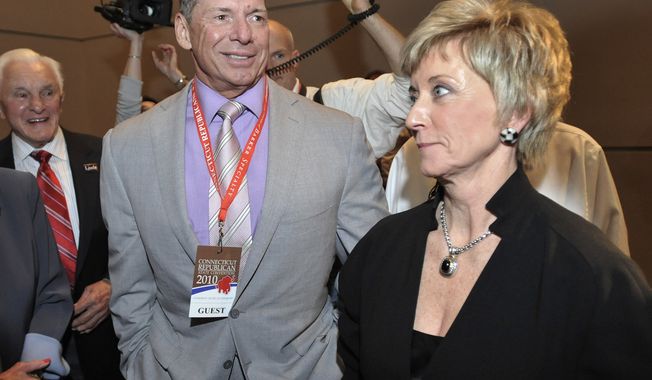 **FILE** Republican candidate for U.S. Senate Linda McMahon (right) and husband Vince McMahon wait for delegate totals to be tallied during the Republican nomination at the Connecticut Republican Convention in Hartford, Conn., on May 21, 2010. (Associated Press)