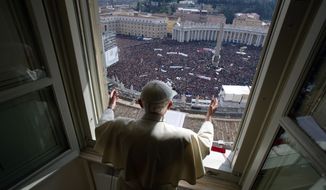 Pope Benedict XVI delivers his blessing during his last Angelus noon prayer from the window of his studio overlooking St. Peter&#39;s Square at the Vatican on Sunday, Feb. 24, 2013. (AP Photo/L&#39;Osservatore Romano)
