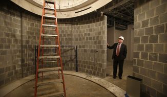 Curt Viebranz, the president of George Washington’s historic Mount Vernon estate, stands outside what will be a climate-controlled book vault inside the under-construction George Washington Library at Mount Vernon, Va., on Wednesday, Feb. 13, 2013. (AP Photo/Jacquelyn Martin)
