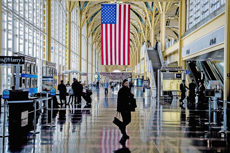 Travelers walk along the main concourse at Ronald Reagan Washington National Airport on Monday, Feb. 25, 2013. (Andrew S. Geraci/The Washington Times)