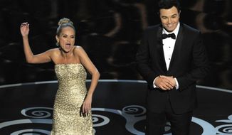 Host Seth MacFarlane, right, and actress Kristin Chenoweth perform a song dedicated to the &quot;losers&quot; during the finale of the Oscars at the Dolby Theatre on Sunday Feb. 24, 2013, in Los Angeles. (Photo by Chris Pizzello/Invision/AP)