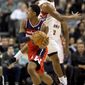 Toronto Raptors guard Alan Anderson, rear, defends against Washington Wizards guard Bradley Beal (3) during the first half of their NBA basketball game, Monday, Feb. 25, 2013, in Toronto. (AP Photo/The Canadian Press, Frank Gunn)
