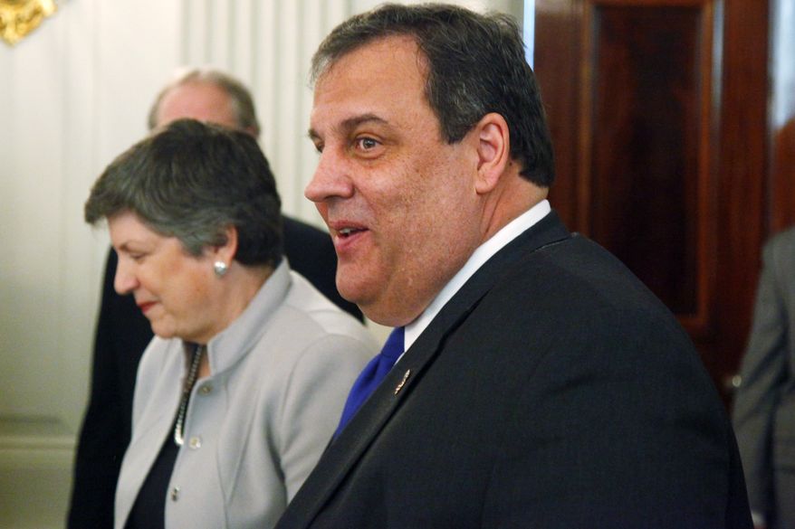 New Jersey Gov. Chris Christie (right) and Homeland Security Secretary Janet Napolitano walk in the State Dining Room of the White House in Washington on Feb. 25, 2013, before President Obama addressed the National Governors Association. (Associated Press)