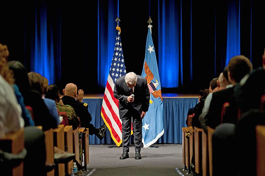 New Secretary of Defense Chuck Hagel gives a bow during his introductory remarks at the Pentagon.