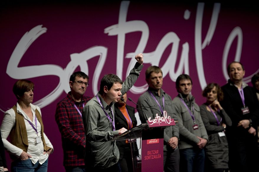 Hasier Arraiz, front, president of the new pro independence Basque party, Sortu, gestures during the inaugural congress, in Pamplona northern Spain on Saturday, Feb. 23, 2013. Sortu was launched formally Saturday, eight months after the Constitutional Court said Sortu could come into existence because it was different to the outlawed Batasuna. (AP Photo/Alvaro Barrientos)