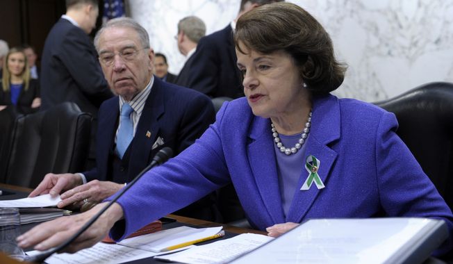 Sen. Dianne Feinstein, D-Calif., right, sits next to the Senate Judiciary Committee&#x27;s ranking Republican, Sen. Charles Grassley, R-Iowa, during a hearing on the Assault Weapons Ban of 2013, Wednesday, Feb. 27, 2013.. (AP Photo/Susan Walsh)