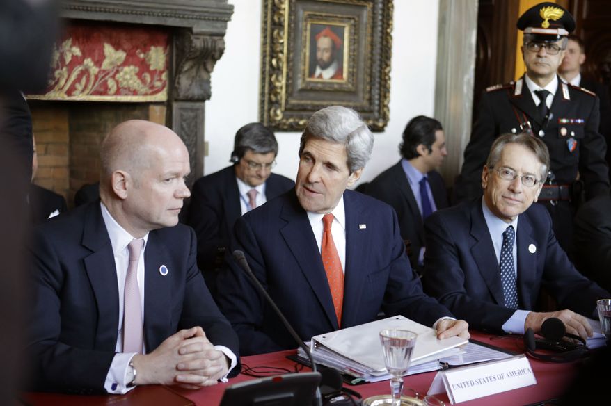 U.S. Secretary of State John Kerry, center, sits between Italian Foreign Minister Giulio Terzi, right, and British Foreign Secretary William Hague during meetings at Villa Madama in Rome on Thursday, Feb. 28, 2013. Rome is the fourth leg of Kerry's first official overseas trip, a hectic nine-day dash through Europe and the Middle East. (AP Photo/Jacquelyn Martin, Pool)