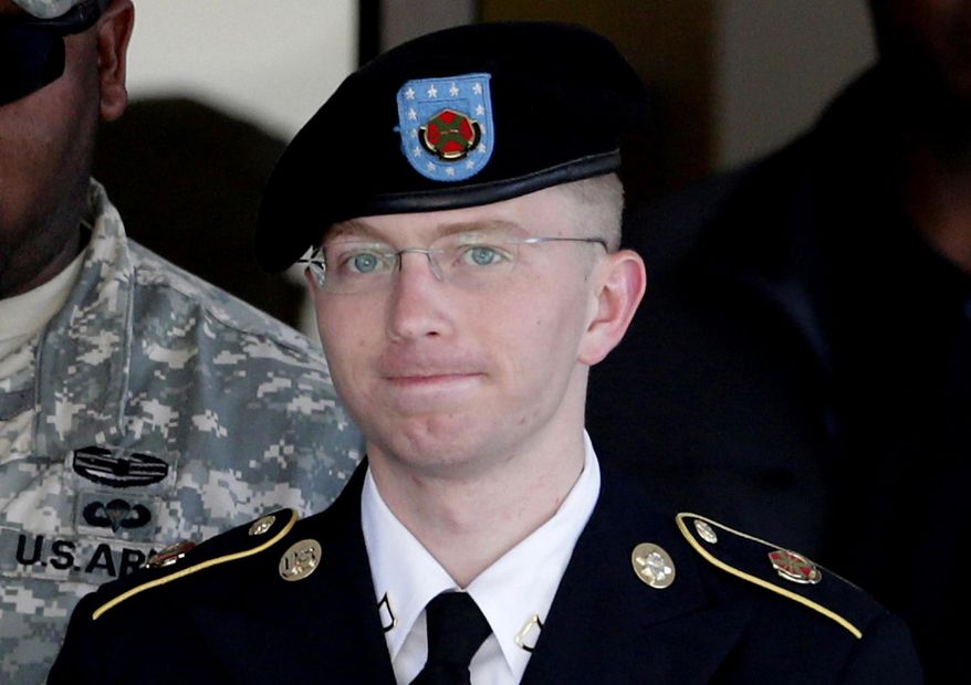 ** FILE ** In this June 25, 2012, file photo, Army Pfc. Bradley Manning, right, is escorted out of a courthouse in Fort Meade, Md. (AP Photo/Patrick Semansky, File)