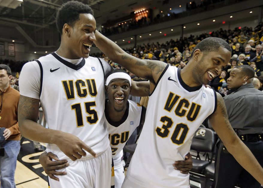 Virginia Commonwealth forward Juvonte Reddic (15), Briante Weber, center, and Troy Daniels (30), celebrate their 84-52 win over Butler in an NCAA college basketball game in Richmond, Va., Saturday, March 2, 2013. (AP Photo/Steve Helber)