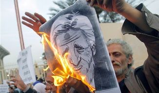 Egyptian activists burn a poster depicting U.S. Secretary of State John Kerry during a protest outside the Egyptian foreign ministry in Cairo, Egypt, Saturday, March 2, 2013. Cairo is the sixth leg of Kerry&#39;s first official overseas trip and begins the Middle East portion of his nine-day journey. (AP Photo/Amr Nabil)