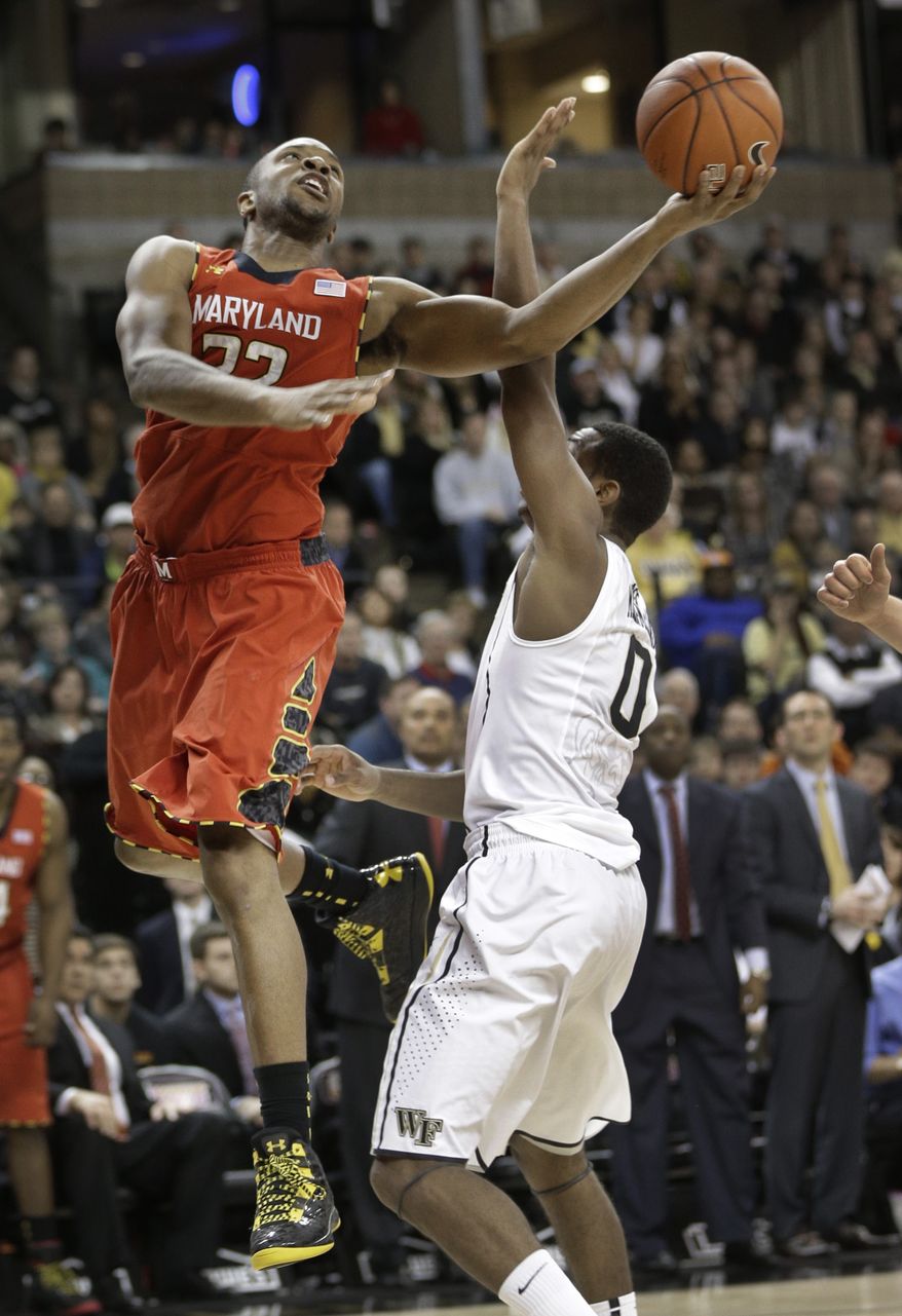 Maryland's Dez Wells (32) drives past Wake Forest's Codi Miller-McIntyre (0) during the second half of an NCAA college basketball game in Winston-Salem, N.C., Saturday, March 2, 2013. Maryland won 67-57. (AP Photo/Chuck Burton)