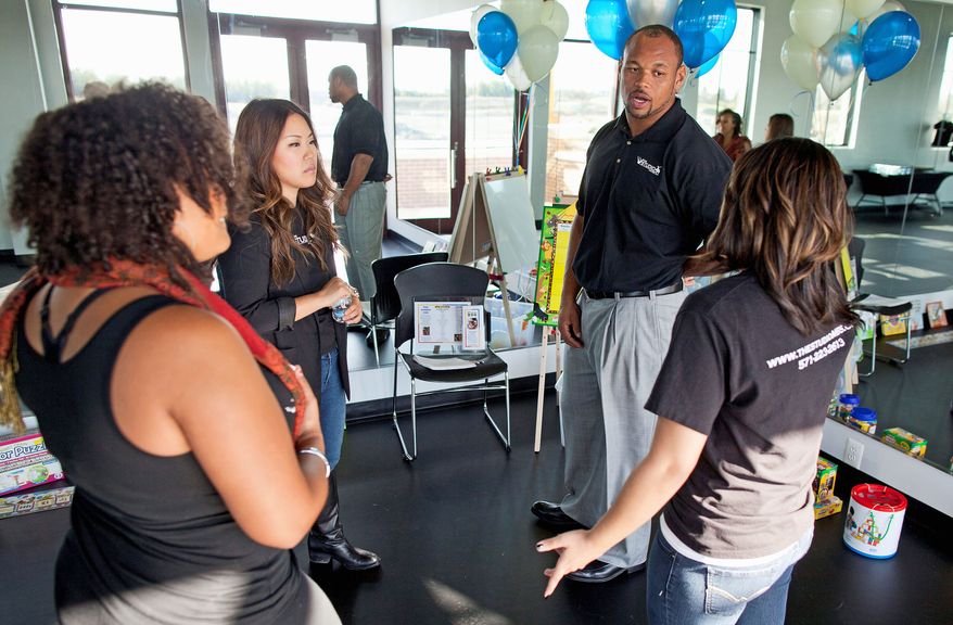 Washington Redskins' Lorenzo Alexander (pictured at the November 2011 grand opening) partners with teammate Kedric Golston to run The Studio MBS in Ashburn. (Pratik Shah/The Washington Times)