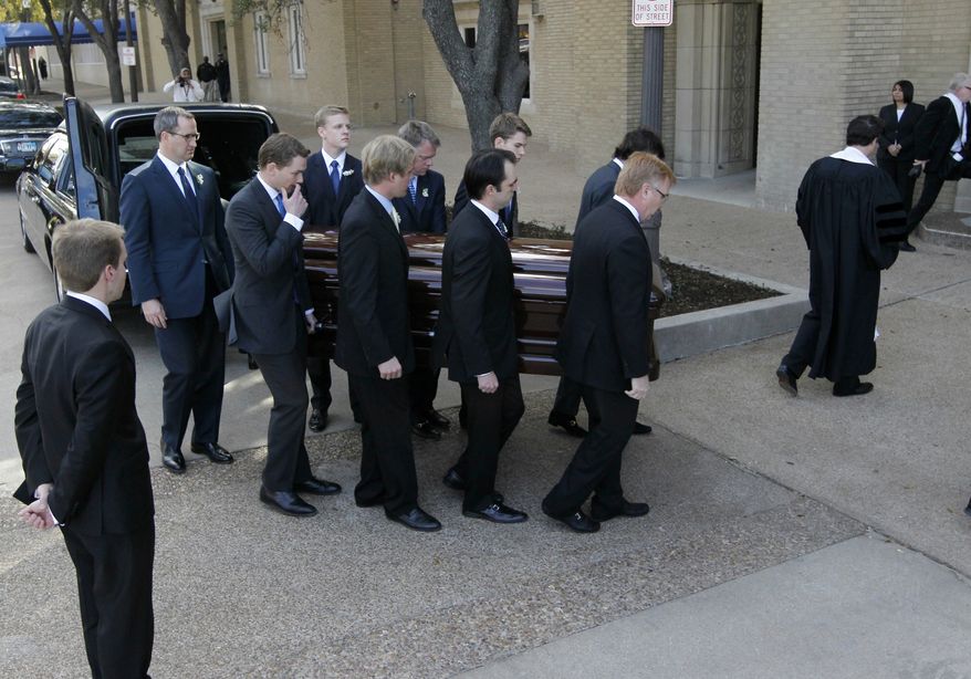 Pallbearers carry the casket of classical pianist Van Cliburn into the Broadway Baptist Church in Fort Worth, Texas, for his funeral service on Sunday, March 3, 2013. (AP Photo/Star-Telegram, Ron T. Ennis, Pool)