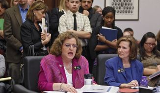 **FILE** Colorado state Sens. Evie Hudak (left), Westminster Democrat, and Linda Newell, Littleton Democrat, testify on their joint bill on school discipline during a hearing at the Capitol in Denver on Feb. 16, 2012. (Associated Press)