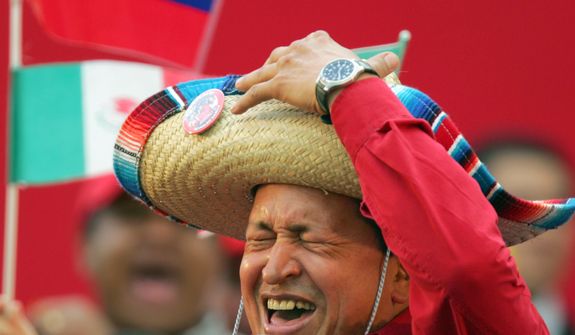 FILE - In this Nov. 19, 2005 file photo, Venezuela&#39;s President Hugo Chavez wears a Mexican sombrero as he sings a Mexican ranchera song at a rally in Caracas, Venezuela.  Venezuela&#39;s Vice President Nicolas Maduro announced on Tuesday, March 5, 2013 that President Hugo Chavez has died at age 58 after a nearly two-year bout with cancer. During more than 14 years in office, Chavez routinely challenged the status quo at home and internationally. He polarized Venezuelans with his confrontational and domineering style, yet was also a masterful communicator and strategist who tapped into Venezuelan nationalism to win broad support, particularly among the poor. (AP Photo/Fernando Llano, File)