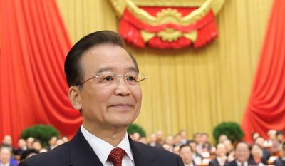 In this photo provided by China&#x27;s Xinhua News Agency, Chinese Premier Wen Jiabao delivers the government work report during the opening meeting of the first session of the National People&#x27;s Congress at the Great Hall of the People in Beijing, Tuesday, March 5, 2013. (AP Photo/Xinhua, Lan Hongguang)