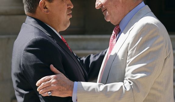 FILE - In this  July 25, 2008 file photo, Spain&#39;s King Juan Carlos, right, shakes hands with Venezuela&#39;s President Hugo Chavez at the Marivent Palace in Palma de Mallorca, Spain. Venezuela&#39;s Vice President Nicolas Maduro announced on Tuesday, March 5, 2013 that Chavez has died at age 58 after a nearly two-year bout with cancer. (AP Photo/Manu Mielniezuk, File)