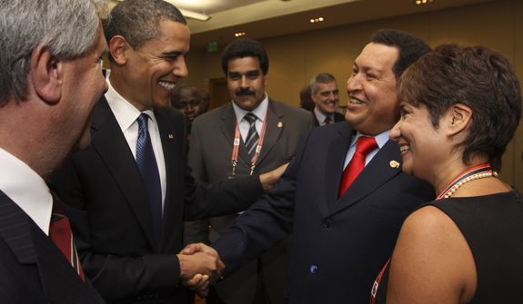 **FILE** President Obama (left) shakes hands with Venezuelan President Hugo Chavez before the opening session of the 5th Summit of the Americas in Port of Spain, Trinidad and Tobago, on April 17, 2009. (Associated Press/Mariamma Kambon, Summit of the Americas)