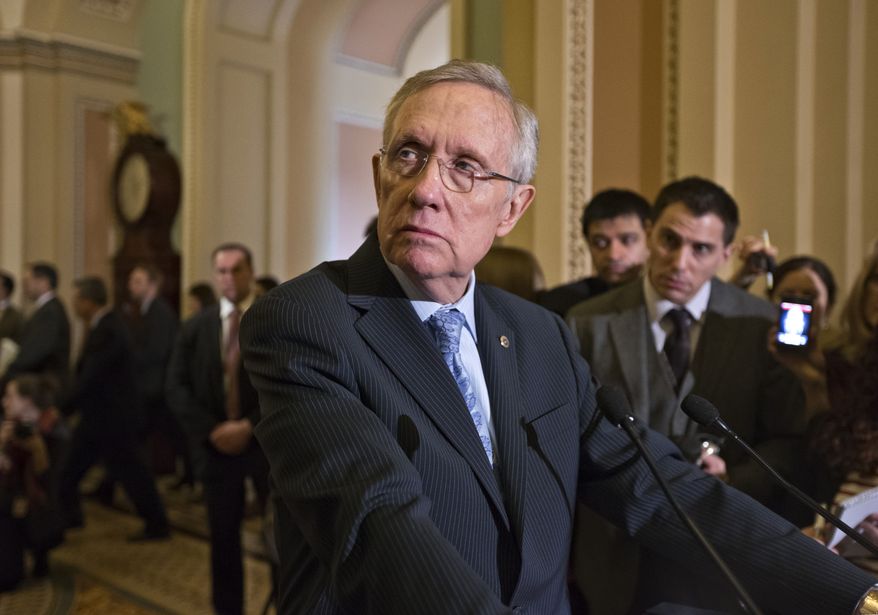 **FILE** Senate Majority Leader Harry Reid of Nevada pauses during a news conference on Capitol Hill in Washington on March 5, 2013, following a Democratic strategy session. (Associated Press)