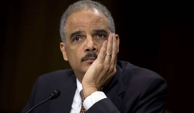 ** FILE ** Attorney General Eric Holder listens as he testifies on Capitol Hill in Washington on March 6, 2013, before the Senate Judiciary Committee hearing &quot;Oversight of the U.S. Department of Justice.&quot; (Associated Press)