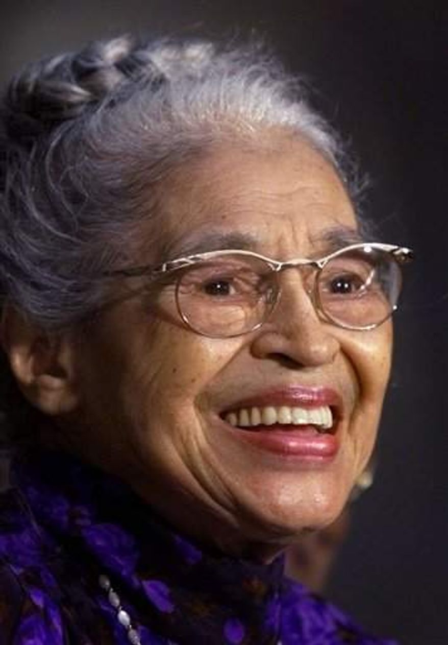 ** FILE ** Rosa Parks smiles during a Capitol Hill ceremony where Parks was honored with the Congressional Gold Medal in Washington on June 15, 1999. Parks became the first black woman to be honored with a full-length statue in the Capitol’s Statuary Hall on Wednesday Feb. 27, 2013. (AP Photo/Khue Bui)