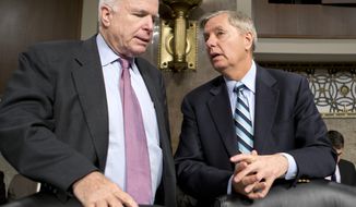 ** FILE ** Republican Sens. John McCain (left) of Arizona and Lindsey Graham of South Carolina confer on Feb. 14, 2013, on Capitol Hill in Washington. (Associated Press)